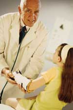 Doctor and girl with broken arm